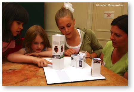 children examining boxes